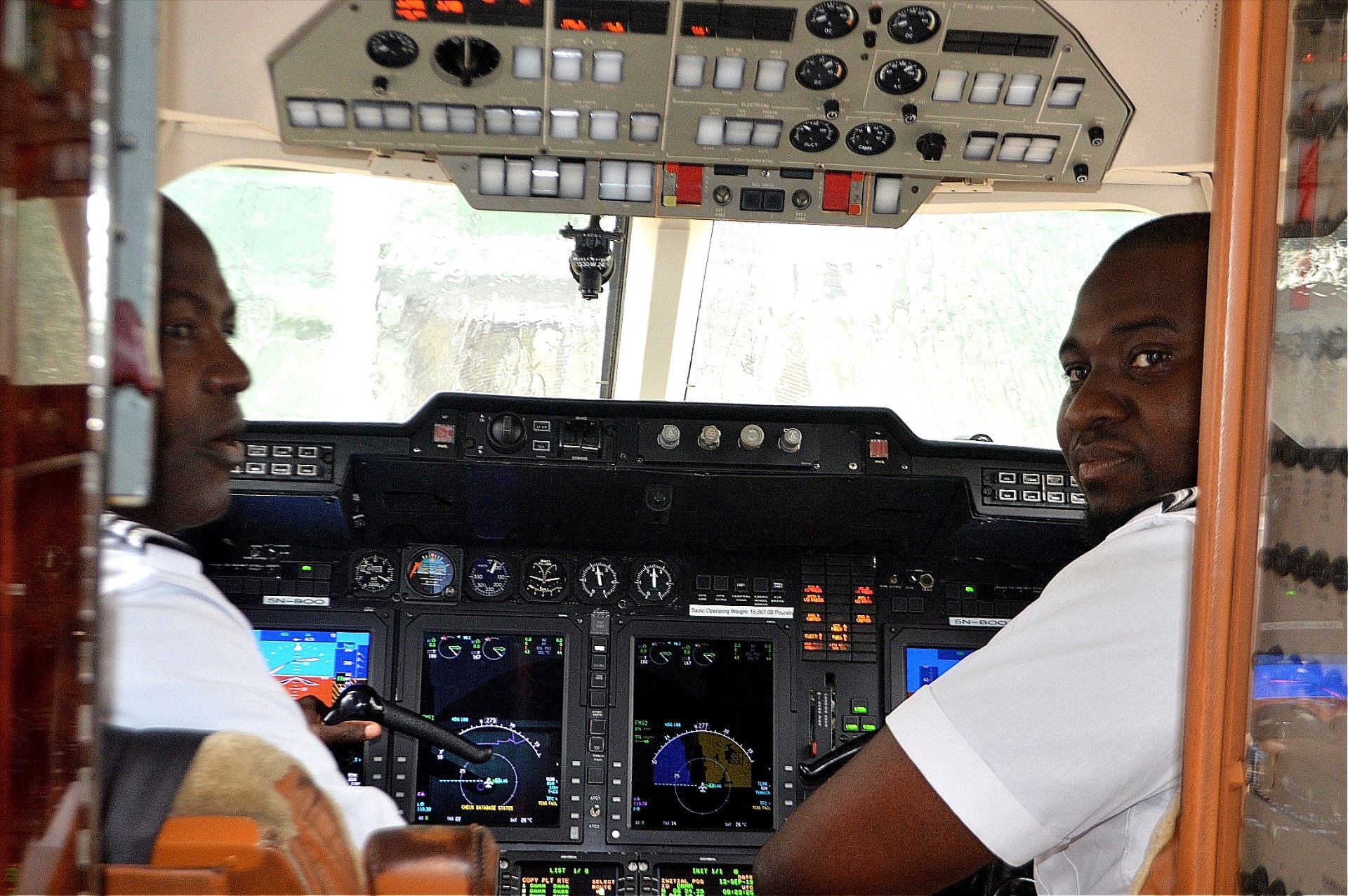 Gyro Air pilots seated in the aircraft cockpit